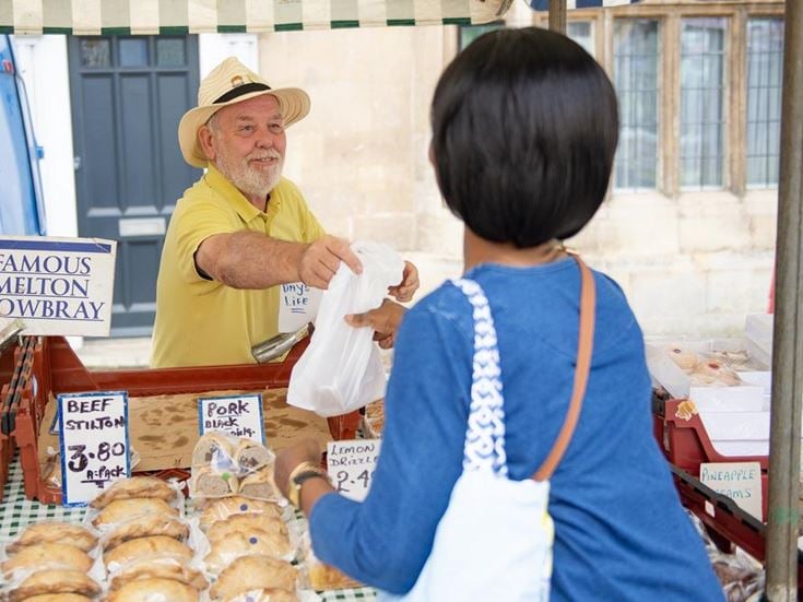 a man and a woman at a market
