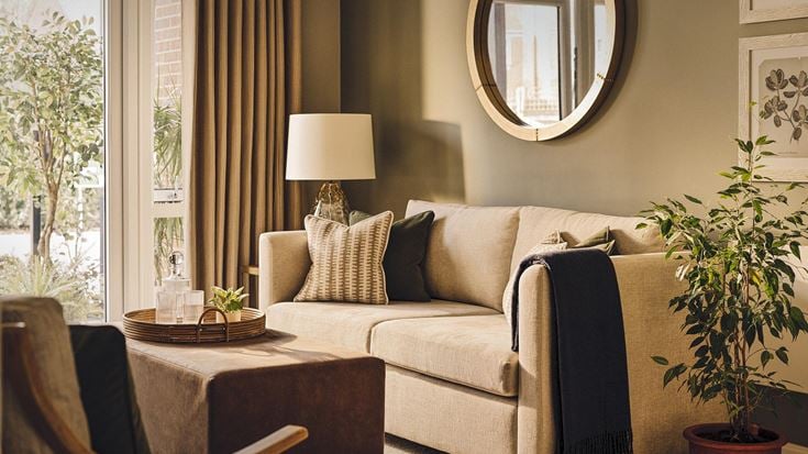 a living room with a couch and a table