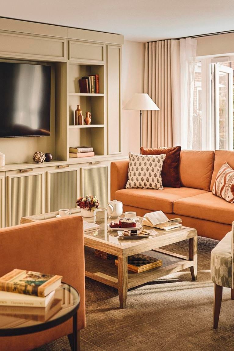 a living room with a tv and couches
